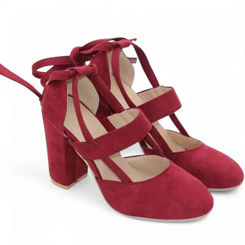 Front three-quarter of deep-red pumps displayed as a pair.