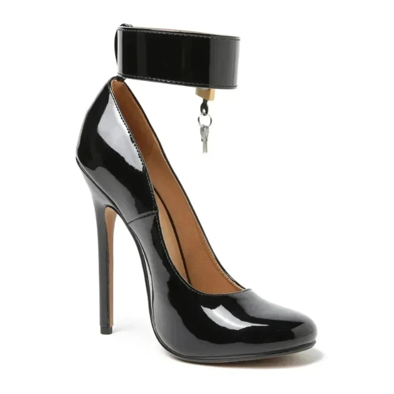Angled view of black patent pump with dangling keys from ankle strap.