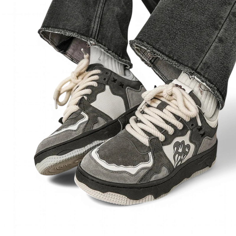 Front-angle stride shot revealing wavy overlays and textured rubber edge.


