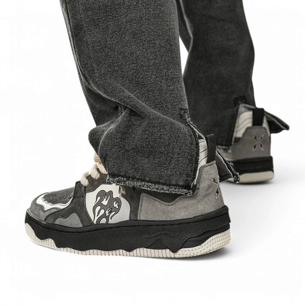 Rear-side shot on foot, showing mid-black sole and abstract floral emblem.

