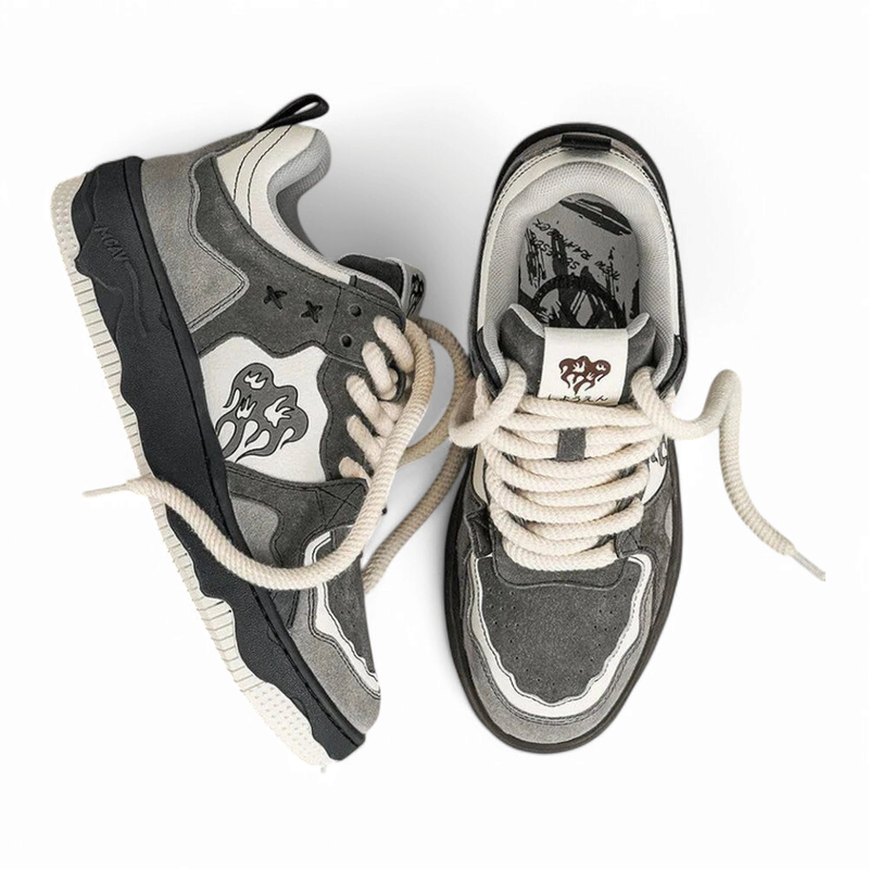 Top-down view highlighting layered grey suede and thick cream rope laces.

