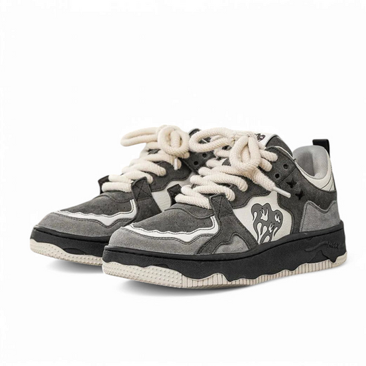 Studio pair shot emphasizing grey-white contrasts and black midsole.

