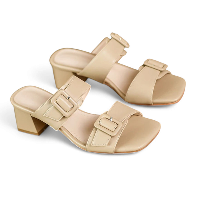Top view highlighting the twin square buckles on beige sandal.