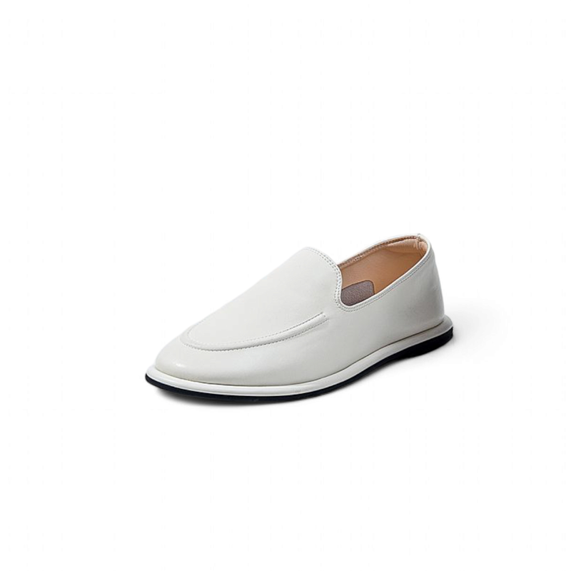 Single white loafer angled on white background