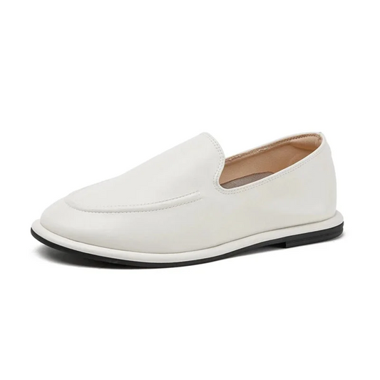 ingle white loafer shown in side profile on white background