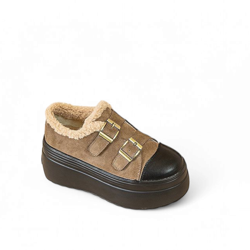 Low-cut brown shoe with two straps, black cap toe, thick platform.