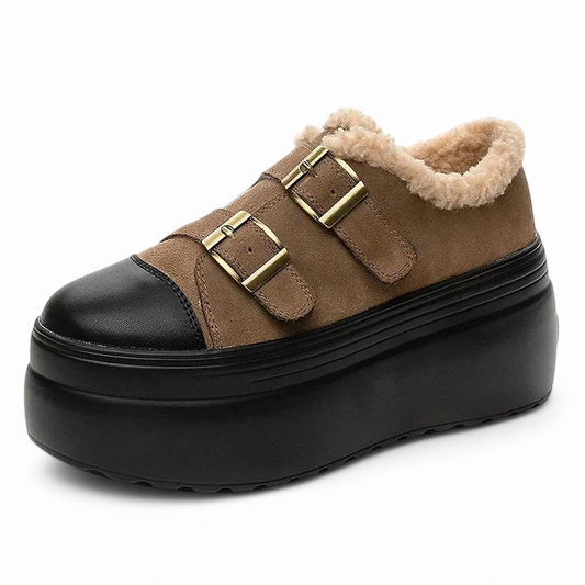 Low-cut brown suede with black cap toe and brass buckles; black platform.