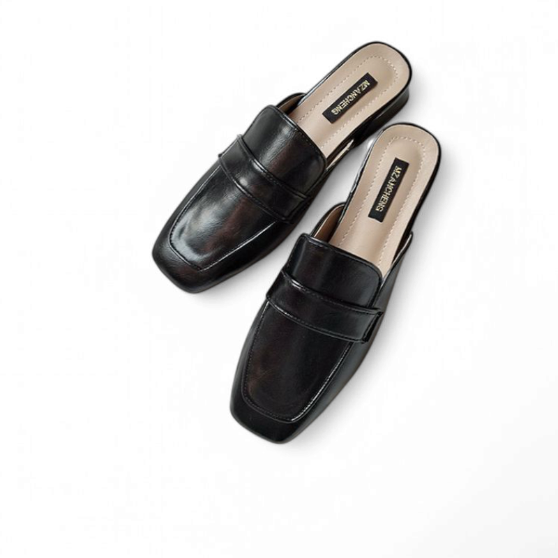 Pair of black square‑toe low‑heel mules shown from an angled top view on white background