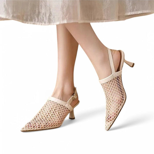 Ivory pair in motion, showing adjustable sling strap and wide mesh over the instep.