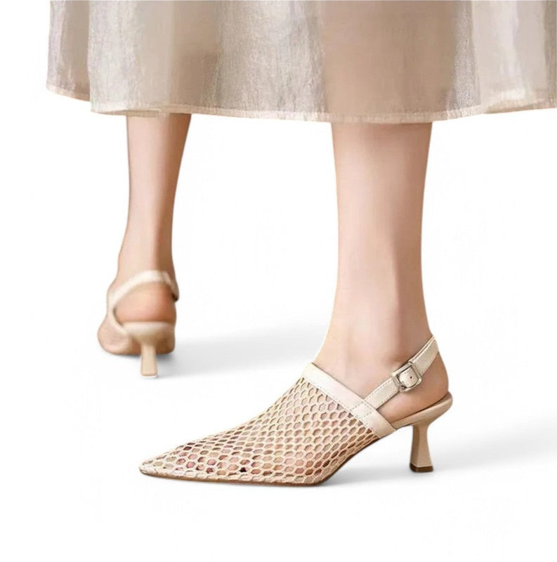 Ivory mesh kitten-heel slingbacks worn with a sheer skirt; front foot in side view, back foot seen from behind.
