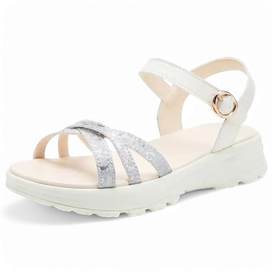 White ankle strap and silver front crossover on a light cream sole.
