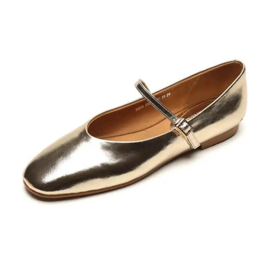 Gold reflective Mary‑Jane with low tan heel on white background