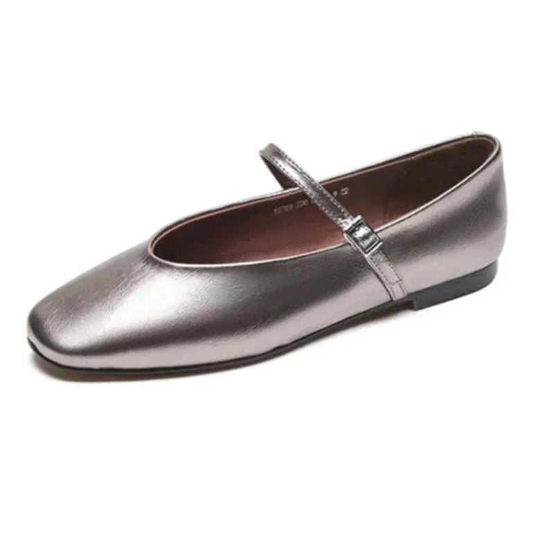 Pewter metallic Mary‑Jane with slim strap and metal buckle on white background
