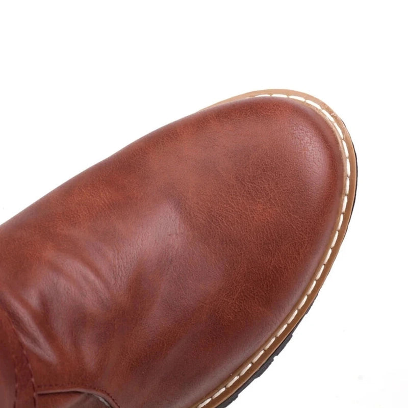 A close-up image highlighting the rounded toe of the Merendy Sassa boot, with a smooth finish and gently curved silhouette.