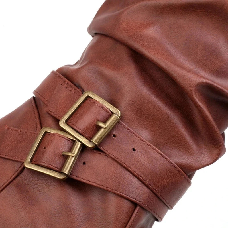 Detailed view of the twin gold buckles and side strap on the Merendy Sassa boot, with soft creases adding texture to the shaft.