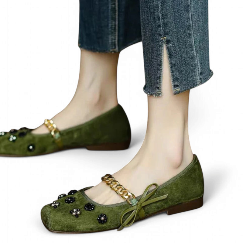 Olive flat with black and pearl bead flowers on a square toe.