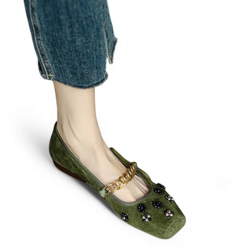 Top view showing suede texture and gold chain on the olive shoe.
