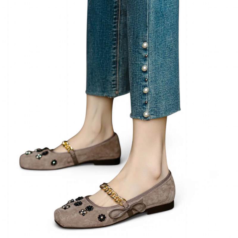 Taupe flat with mixed bead flowers worn beneath pearl-button denim.