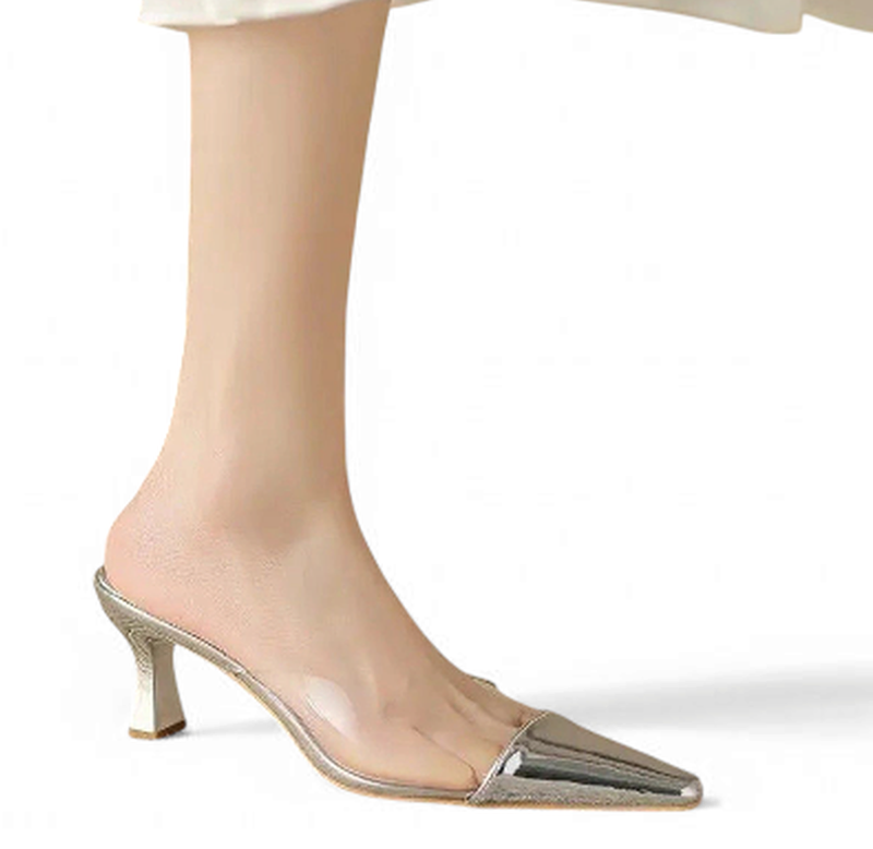 Silver version worn on foot, showing metallic side line and kitten heel.