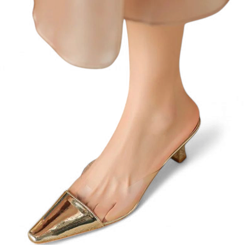 Top view of the gold mule, pointing out the sharp toe and clear panel across the vamp