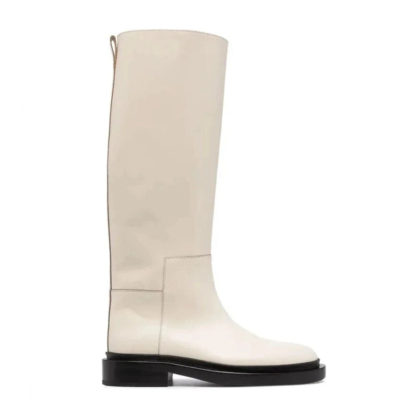 Side view of the Merendy Sustate beige knee-high boots, highlighting the soft leather texture and minimalist wide-calf design.