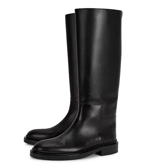 Pair of Merendy Sustate minimalist black knee-high boots positioned side by side, showcasing the smooth leather finish and timeless silhouette.