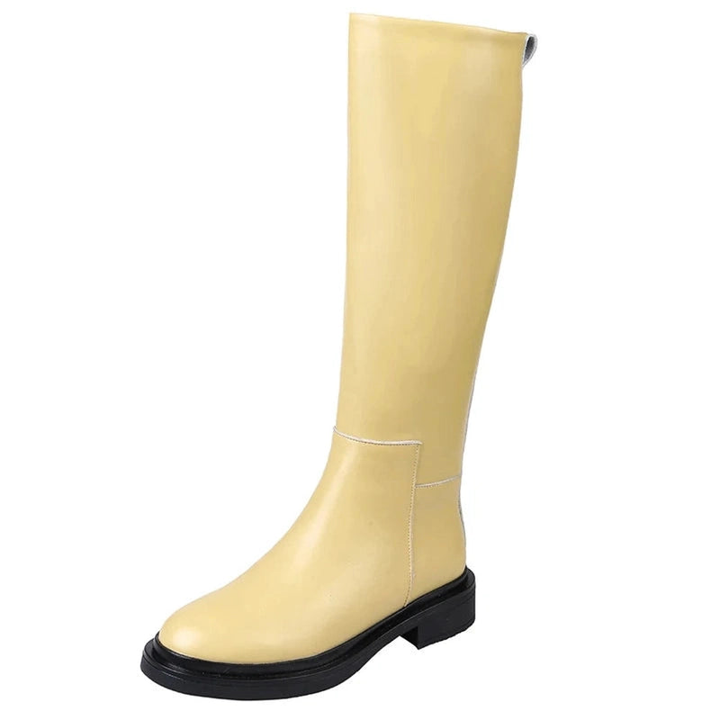 Front view of a single Merendy Sustate yellow knee-high boot, showcasing its clean silhouette and softly rounded toe.