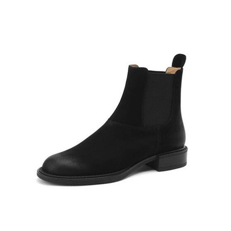Single black Chelsea boot in side view