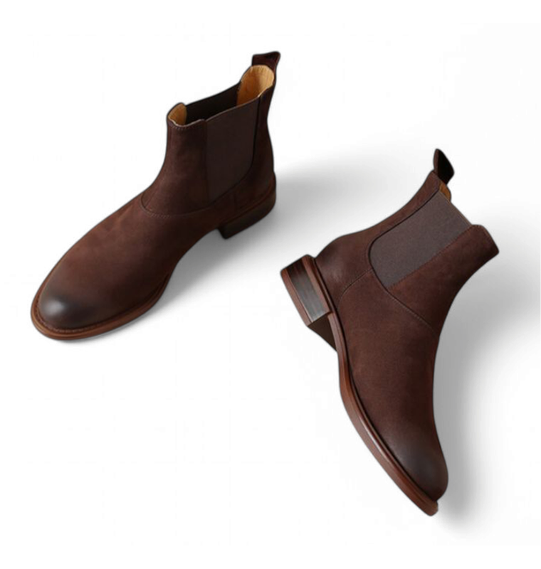 Brown leather Chelsea boots with matte finish, overhead view of both boots