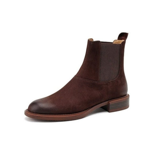 Single brown Chelsea boot in side view