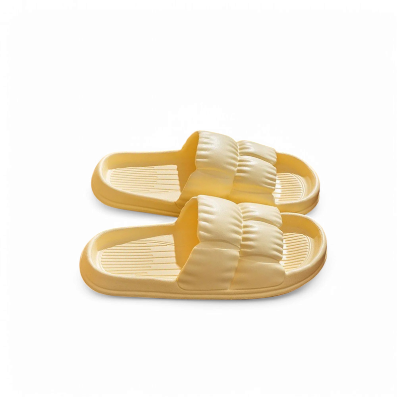 Lemon-yellow slide featuring a ruched padded band and grooved insole.