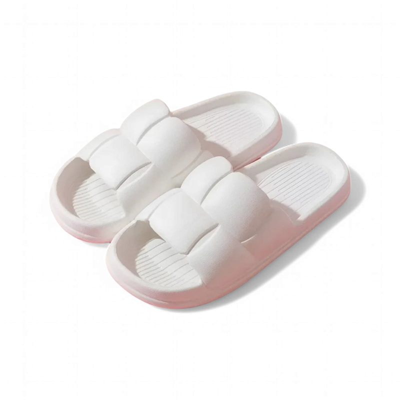 The same pillow-strap design in white, fading to soft pink along the sole.