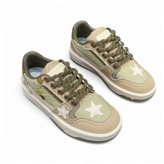 Olive-green sneaker pair with stitched stars, slightly angled three-quarter view.

