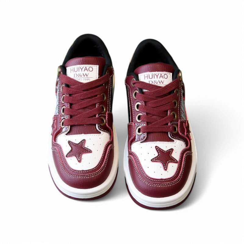 wine red sneaker pair with white accents and front star, studio setting on white.

