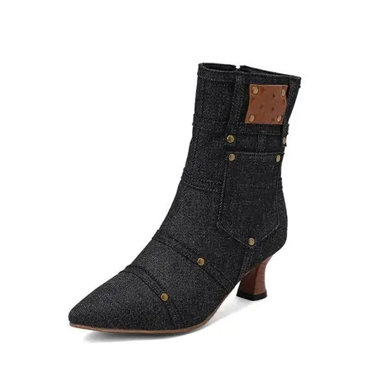 Black denim ankle boot, brass logo patch and curved kitten heel.	