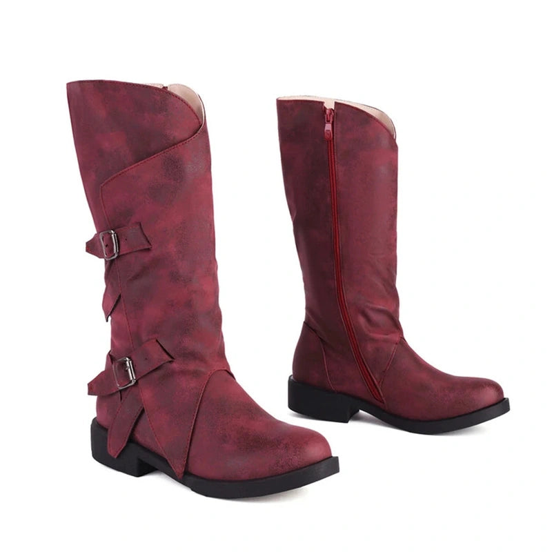 Two matching red boots side by side, showing consistency in finish and structure