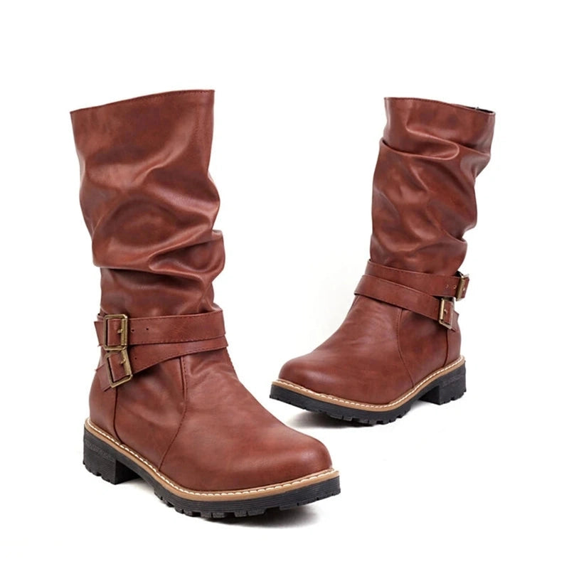 A front-angled shot of both Merendy Sassa boots in brown, showing the soft slouchy shaft and elegant side buckles.