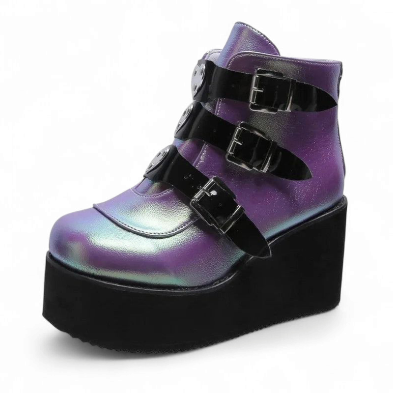 Side view of purple iridescent wedge boot with contrasting black buckles.