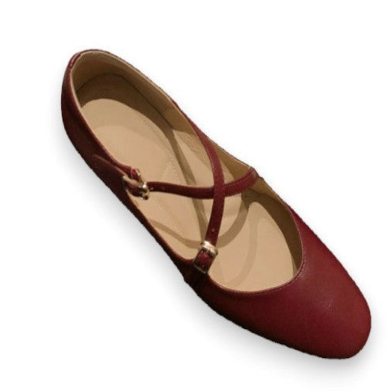 Top angled view of burgundy Mary-Jane showing cross-straps and pigskin lining on white background.