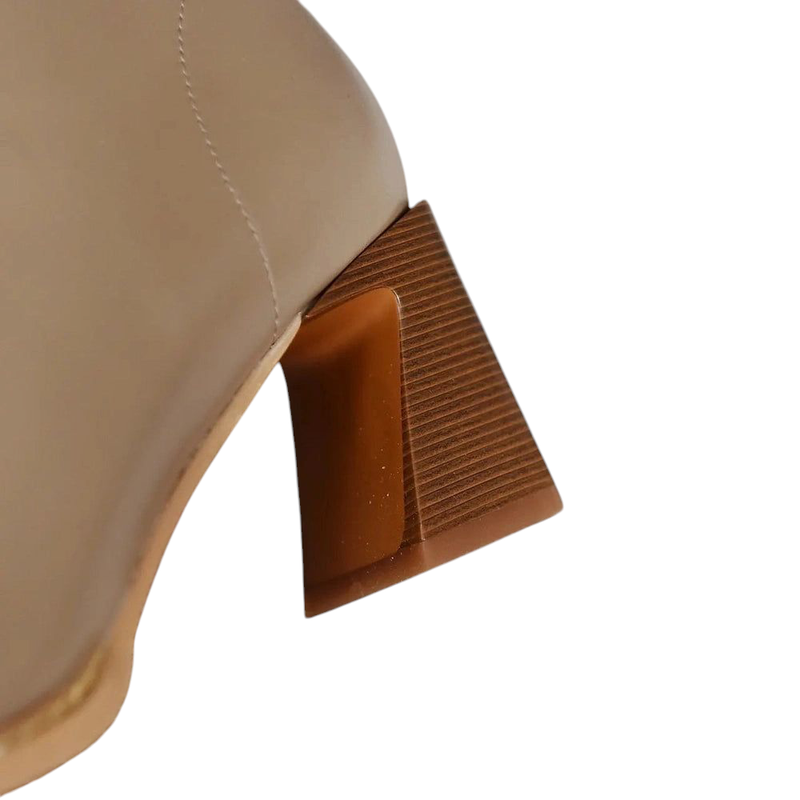 Close-up of the angled stacked heel on Ranya leather boots