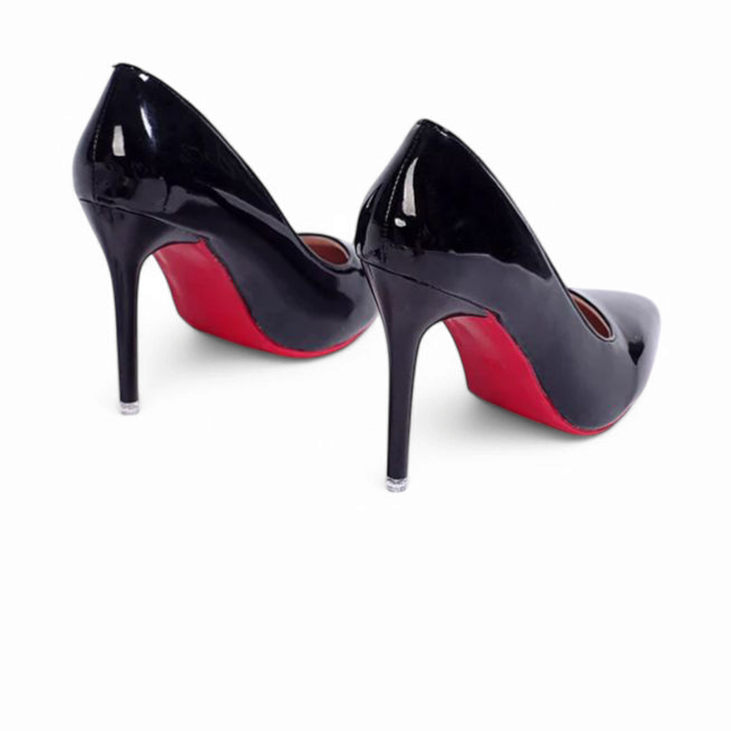 Rear view of black stilettos highlighting red outsoles and slim heels.