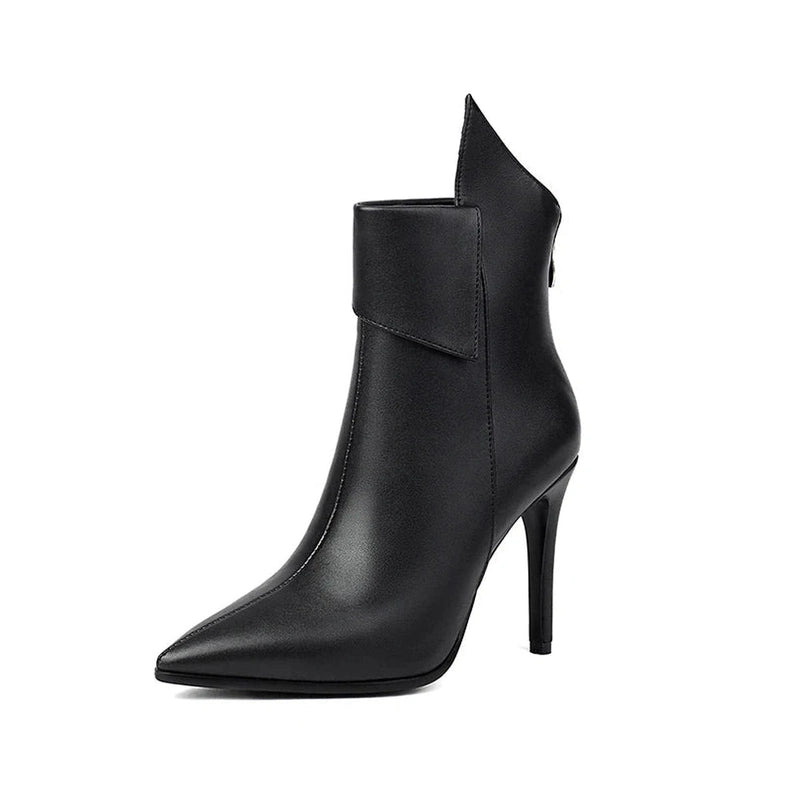 Black ankle boot on white background, showing sharp collar fin and sleek heel.