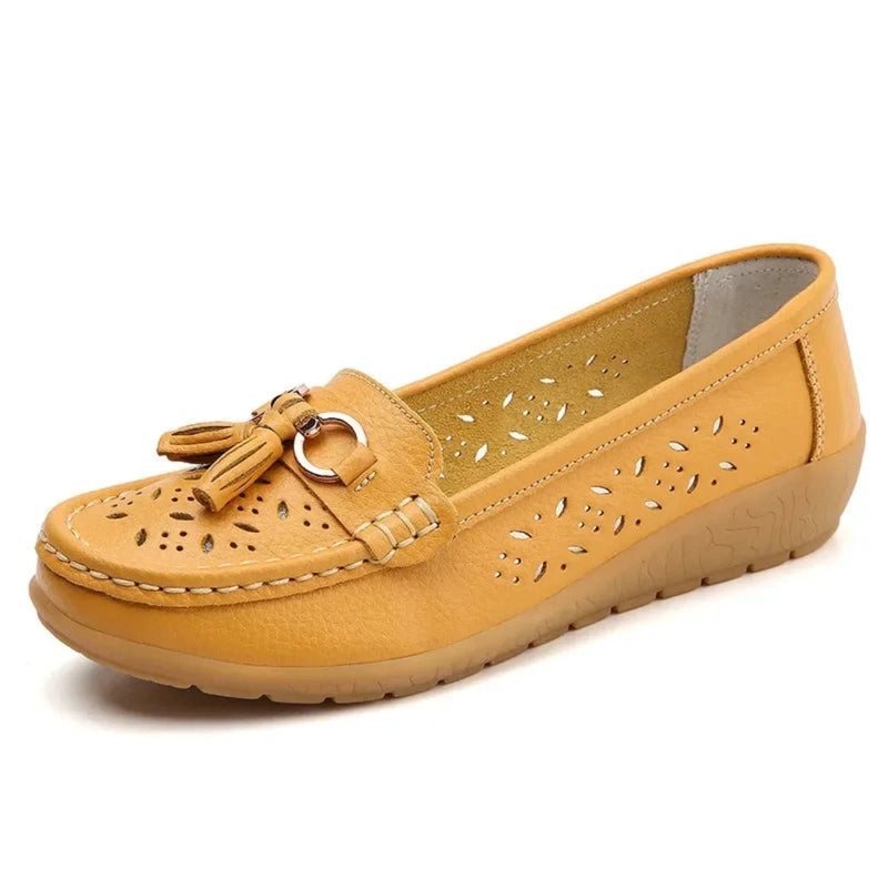Mustard square‑toe loafer with tassels and cut‑outs, side view	