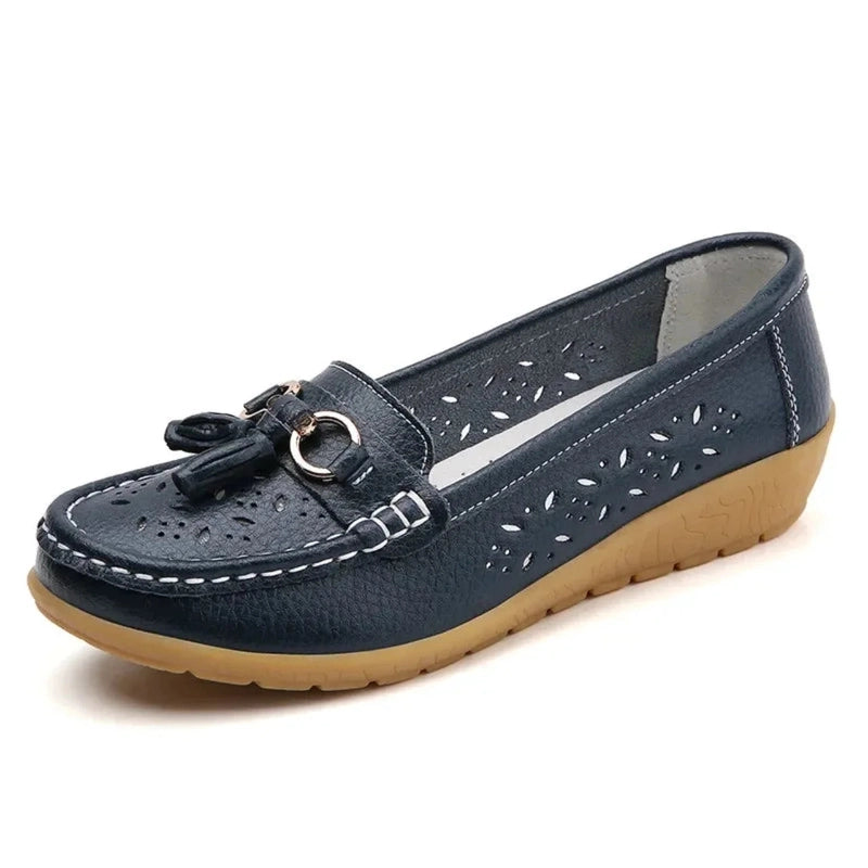 Navy blue square‑toe loafer with white stitching