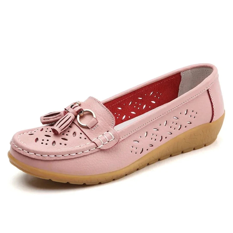 Soft pink tassel loafer with cut‑out pattern