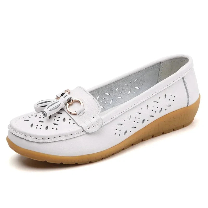 White square‑toe loafer, tassels and silver ring accent