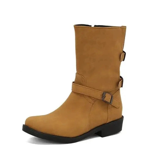 Side profile of the boots showing dual buckle accents, low square heel, and wide-calf fit in warm brown.
