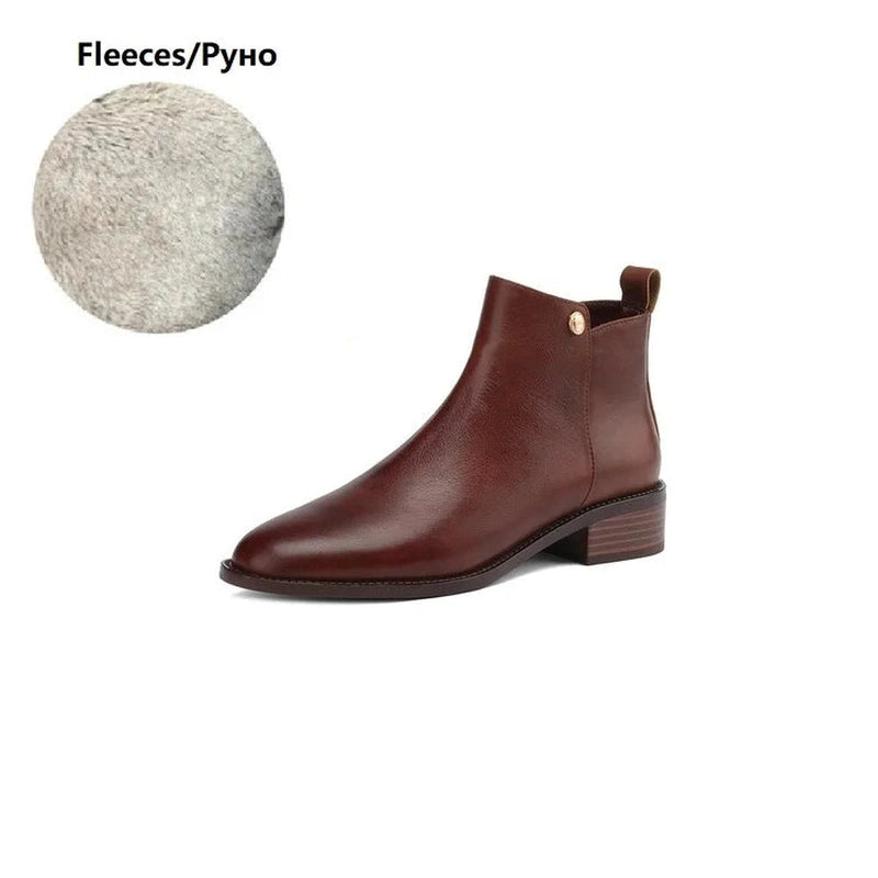 Brown leather ankle boot with low heel and clean side view