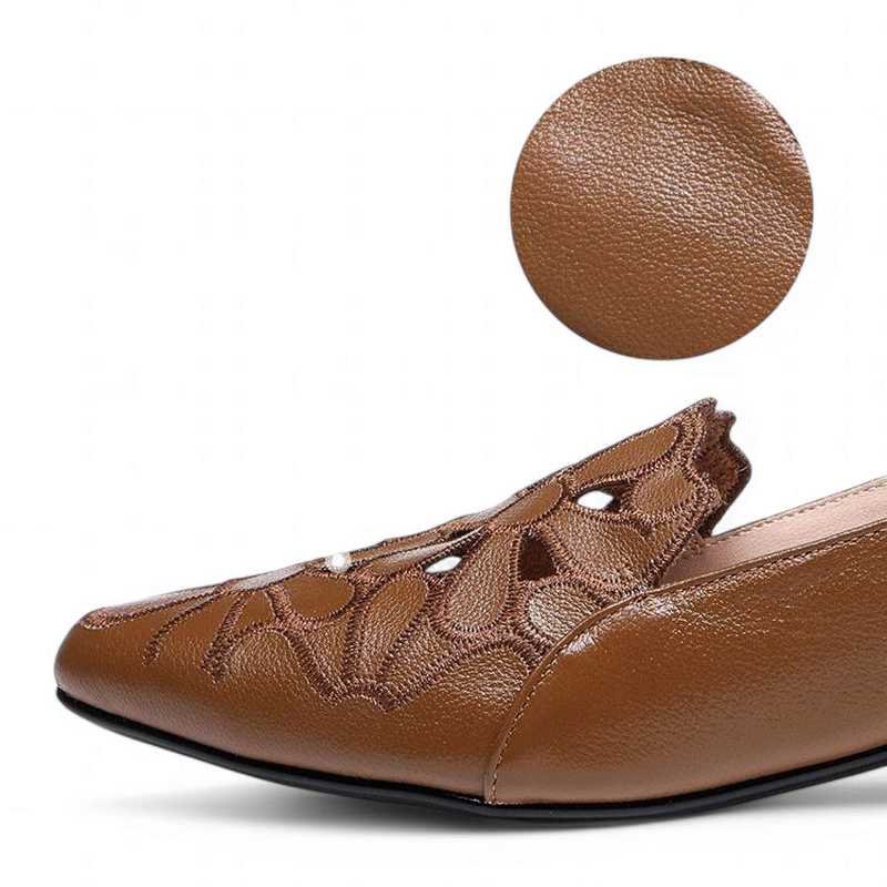 Side view of the pointed brown toe with a circular PU-texture swatch.
