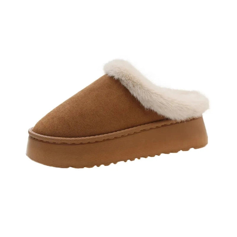 A brown slip-on platform slipper with a minimal faux fur trim outlining the top edge.